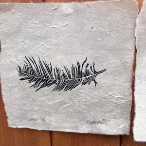 copper feather and black feather pair of linoprints on handmade paper